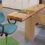 Beam Bench is a cantilevered vice station (shown with adjustable chair)